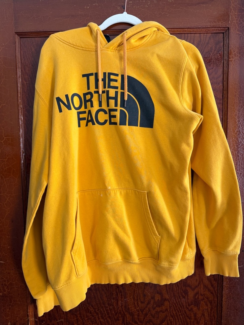 The North Face Men’s Golden Yellow Pullover Hoodie with Black Logo